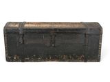 an old black trunk with a metal latch on it