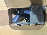 a box that has a hair dryer and a bag in it