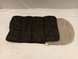 a sleeping bag on a bed with a pillow on it