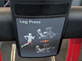 a sign that says leg press on the side of a bench