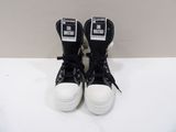 black and white converse sneakers with white soles on a white surface