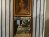 a picture of a painting on the wall next to a mirror