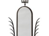 a black and white photo of a mirror with a metal frame