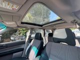 a view of the inside of a car from the driver ' s seat