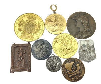 a lot of coins that are on a white surface