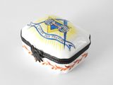 a small white box with a blue and yellow emblem on it