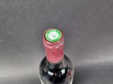a bottle of wine that is sitting on a table