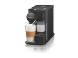 une machine à café noir avec un verre de lait à côté