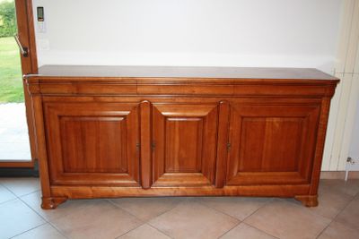an image of a wooden cabinet in a living room