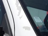 a sticker on the side of a car that has a sticker on it