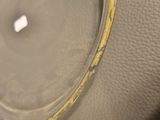 a close up view of a clock on a table