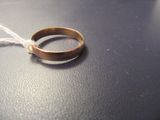 a wedding ring on a table with a string