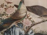 painting of two birds sitting on a branch with flowers in the background