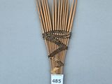 une image représentant un bouquet de tiges de bambou avec une étiquette de prix