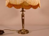 a lamp that is sitting on a table next to a lamp