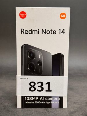 a box of redmi note 14 with the packaging open