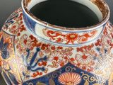 a vase with a design on it on a table