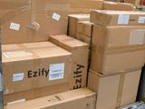 many boxes stacked on top of each other in a warehouse