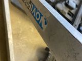 a machine that is sitting on a table with a knife in it
