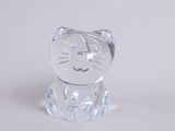 crystal figurine of a cat sitting on a white surface