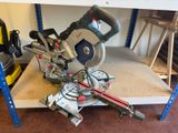 a picture of a miter saw on a shelf in a garage