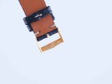 a close up of a watch strap with a gold buckle