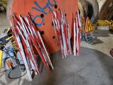 many skis that are sitting on a rack in a garage
