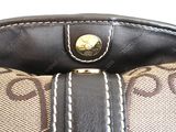 a close up of a purse with a handle