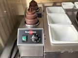 an image of a commercial kitchen with a hot pot on the burner