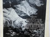 an old black and white photo of a mountain with snow on it