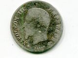 une vieille pièce de monnaie avec un visage d'homme dessus