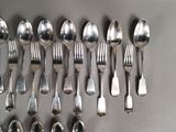 a lot of spoons and spoon spoons on the table