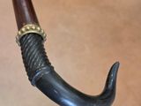a close up of an umbrella handle with a ring on it