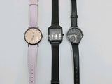trois montres de styles différents posées côte à côte sur une surface blanche