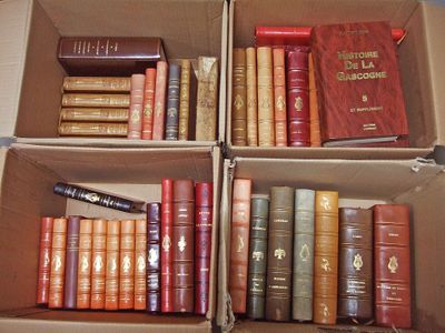 several boxes of books are stacked on top of each other