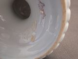 a close up of a vase on a table