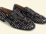 black studded loafer shoes on a white background