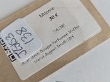 a label on a piece of paper that is on top of a piece of paper