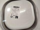 a plastic container with a label on it on a table