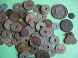 a lot of coins that are on a green surface