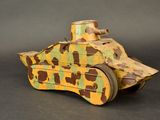 a wooden toy tank that has a camouflage pattern on it