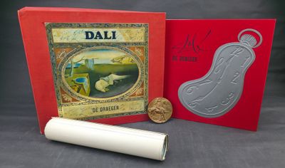 a red box with a picture and a roll of paper next to it