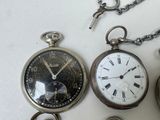 three different types of pocket watches on the table