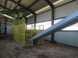 a conveyor belt in the middle of a building