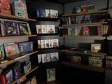 many books that are on the shelves in the room
