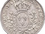 a silver coin with a crown on top of it