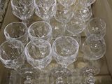 many empty wine glasses in a box on the table