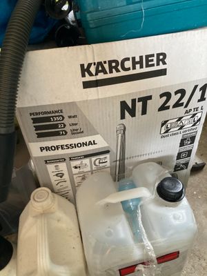a box of water and a canister of water on the floor