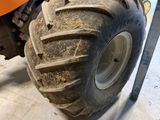 a tractor that is parked in a garage