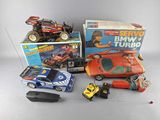 many toy cars and remote controls on the table